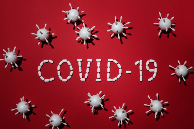 Canva – Concept Of Covid-19 In Red Background 2