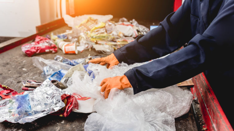 At,Modern,Recycling,Plant.,Separate,Garbage,Collection.,Workers,Sorting,Trash